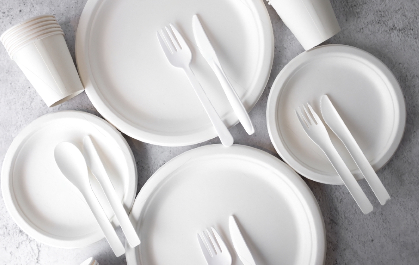 stock-photo-set-of-empty-reusable-disposable-eco-friendly-plates-cups-utensils-on-light-white-and-grey-1351796321-transformed